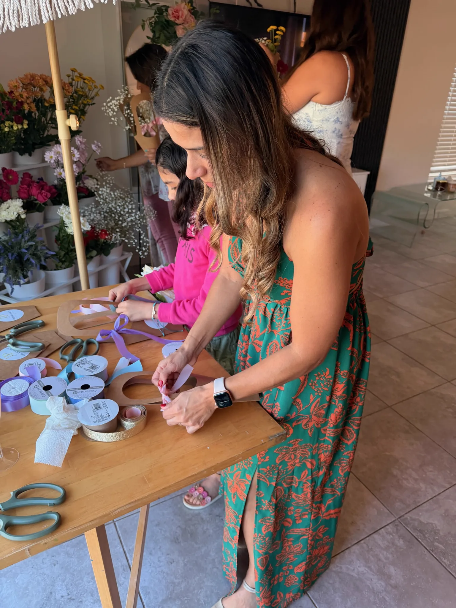 Guests building bouquets at a flower bar activation