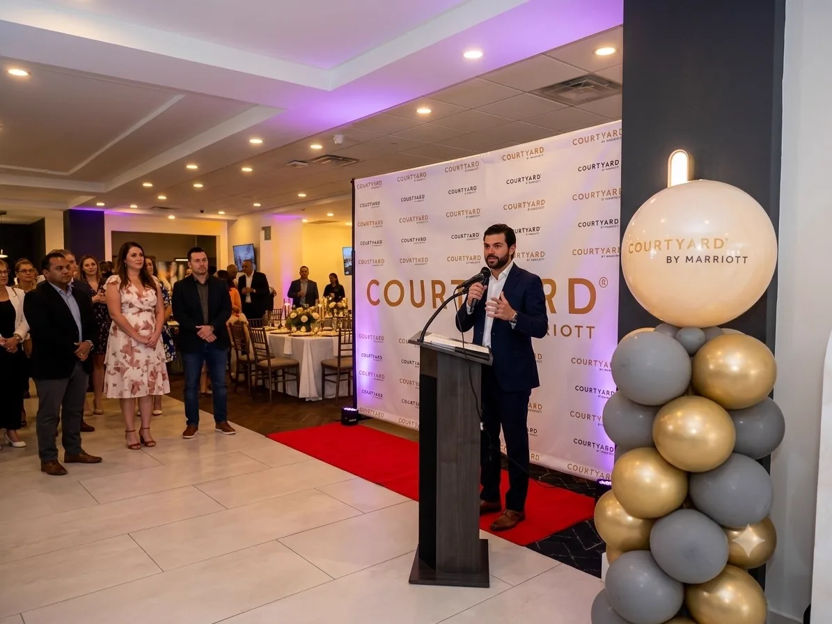 Corporate stage set with balloon accents and branded backdrop